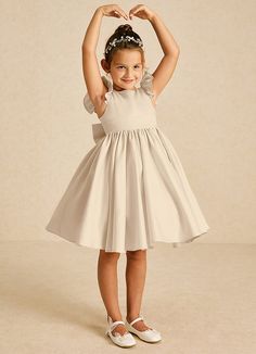 Tootsie exudes elegance with its A-line design in matte satin. Featuring a classic scoop neckline, a chic V-back, and sweet cap sleeves, it’s beautifully adorned with charming bows, making it a delightful choice for any formal event. Short Flower Girl Dresses, Tiny Outfits, Champagne Flower Girl Dresses, Satin Flower Girl Dresses, Champagne Flower Girl, Flower Girl Dresses Champagne, Satin Flower Girl Dress, Military Ball Dresses, Sage Dress