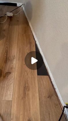 an image of a wood floor that is being installed on the wall with wires attached to it