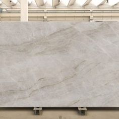 a large white marble slab in a warehouse