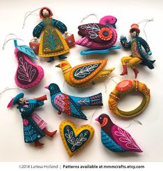 colorful ornaments are arranged in the shape of birds