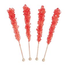 three red candy lollipops sitting next to each other on a white background