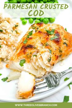 a white plate topped with chicken and rice covered in parmesan crusted cous