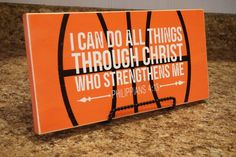 an orange sign that says i can do all things through christ who straightens me