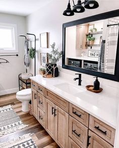 a bathroom with wooden cabinets and white counter tops