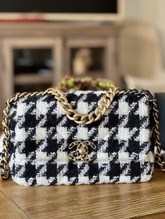 Chanel 19 Black White Houndstooth SMALL (rare! the 19 houndstooth was not assorted in this size for North America, bought it from Japan CHANEL boutique) PP Invoice and shipped: $7000 9.5/10 (used less than 10 times) Comes with full set (receipt, box, dustbags, tissues, authenticity card) All Sales Final, Serious buyers only! Feel free to ask any questions. The sizing is kind of confusing/misleading for 19s especially. Being 5'2, the medium looked huge on me but was obsessed w/the bag when it first came out that I was willing to pay a huge premium w/a reputable reseller (have real receipts) for the small which was available in Europe/Asia. For the 19s, the "small" is more like the classic flap medium and the "medium" is more like a jumbo. Due to the nature of the design of the bag, the smal Chanel Fabric Bag, Tas Louis Vuitton, Chanel 19, Chanel Inspired, Luxury Purses, Holy Grail, Cute Bags, Fabric Bag, Fashion Editor