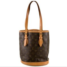 Louis Vuitton Bucket Bag From The 2003 Collection Vintage Brown Coated Canvas Lv Monogram Brass Hardware Leather Trim Dual Adjustable Shoulder Straps Leather Lining & Dual Interior Pockets Open Top Protective Feet At Base Details: Shoulder Strap Drop: 9.25" Height: 10" Width: 10.75" Depth: 6" Used Condition See Photos For Signs Of Wear Formal Brown Monogram Canvas Bucket Bag, Brown Monogram Canvas Bucket Bag With Detachable Handle, Formal Monogram Canvas Bucket Bag With Gold-tone Hardware, Designer Brown Bucket-shape Shoulder Bag, Luxury Vintage Brown Bucket Bag, Brown Bucket Bag With Gold-tone Hardware For Daily Use, Versatile Brown Bucket Bag With Gold-tone Hardware, Louis Vuitton Bucket Bag, Louis Vuitton Vintage