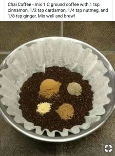 a metal bowl filled with food on top of a tiled floor