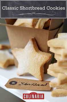 some sugary shortbreads are on a white plate and there is a tag that says classic shortbread