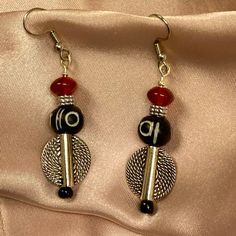 Offering A Brand New, Handmade Pair Of Drop Earrings Featuring A Textured .5” Shield, A 10mm Black & Cream, Silver Spacer & Red Rondel. These Earrings Are Set On Silver Wire With Stainless Steel Ear Wires. They Are Approx. 2” In Length. Treat Yourself Or Treat Someone Special! Beaded Jewelry Necklaces, Silver Wire, Black Cream, Ear Wires, Jewelry Inspiration, Black Red, Beaded Jewelry, Black And Red, Size 2