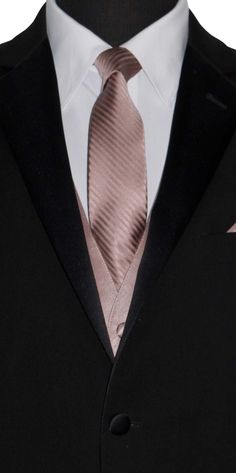 a man in a suit with a pink tie