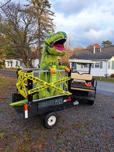 a fake alligator is riding in the back of a utility truck with caution tape on it