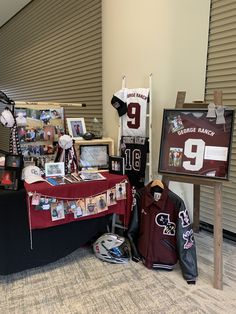 a table that has some items on it and is covered in pictures, photos, and memorabilia