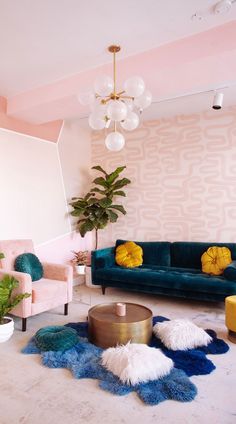 a living room filled with furniture and a potted plant