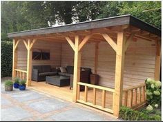 a wooden gazebo with an outdoor living area in the background and pinterest logo above it