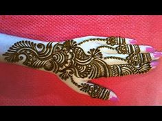 a woman's hand with henna on it