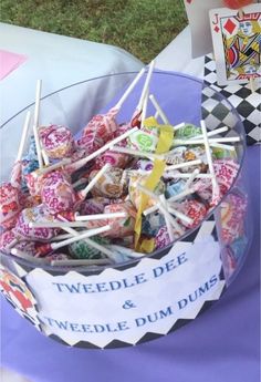 a bowl filled with candy sitting on top of a table