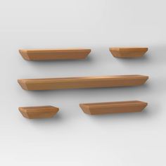 four wooden shelfs are arranged on the wall