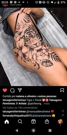 a woman's thigh with flowers on it and the bottom half of her leg