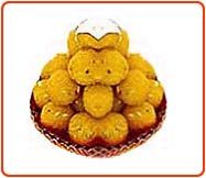 a basket filled with yellow teddy bears sitting on top of a table