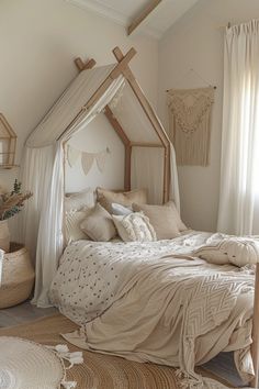 a bedroom with a canopy bed and pillows