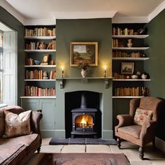 a living room filled with furniture and a fire place next to a book shelf full of books