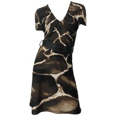 Chic and rare vintage mid / late 80s ROBERTO CAVALLI for NEIMAN MARCUS giraffe print belted short sleeve jersey dress! Features timeless giraffe animal print in chocolate brown and ivory. Flattering ruched tailored bodice and sleeves. Hidden zipper up the side. Detachable brown silk belt. Can easily be dressed up or down. Great with wedges, flats or sandals for day, and heels or boots for evening. In great condition. Made in Italy Marked Size IT 42 ( US 6 / 8 ) Measurements: (lots of stretch) 34 90s Jersey, Grey Silk Dress, Giraffe Dress, Roberto Dress, Informal Dress, Classy Fits, Jersey Vintage, Printed Gowns, Black Dress With Sleeves