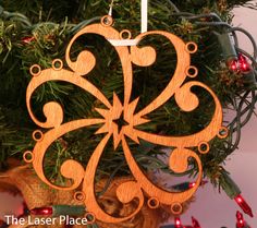 a wooden ornament hanging from a christmas tree