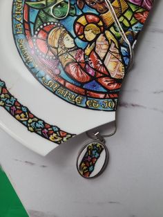 a white plate with a stained glass design on it