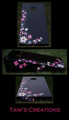 an image of a cornhole game with flowers painted on the side and in front