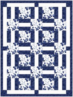 a blue and white quilt with stars on it