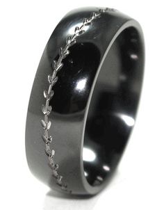 a black ring with silver chains on it