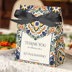 a thank you card sitting on top of a table next to a plate of food