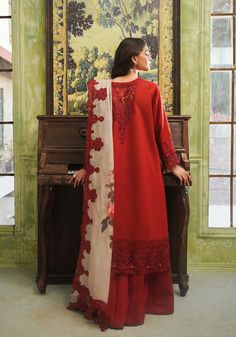 Brand: ZarqashProduct Code: ZQT 007 ROSALINECollection: Zarqash Tresor Unstitched Luxury Lawn CollectionFabric: Lawn DESCRIPTION Introducing “Rosaline,” presented in a scarlet red hue that radiates serenity and elegance. Delicate embroideries, rendered in silk threads of rogue scarlet and maroon adorn the fabric with intricate motifs inspired by the beauty of nature. The shirt’s borders exhibit meticulous craftsmanship, while the contrasting digital print dupatta features embroidered details reminiscent of swirling garden blossoms. “Rosaline” offers wearers the opportunity to embody elegance and sophistication in every step, making it a perfect choice for those seeking understated yet refined sartorial expressions. DESIGN DETAILS: Schiffli Embroidered Center panel (Right) Schiffli Embroide Pakistani Designer Clothes, Velvet Shawl, Organza Sleeves, Lawn Suits, Pakistani Designers, Suit Fabric, Plum Color, Pakistani Outfits, Fabric Stores Online