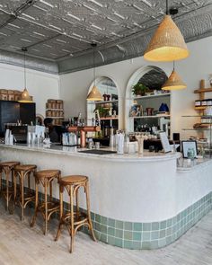 a bar with stools in front of it