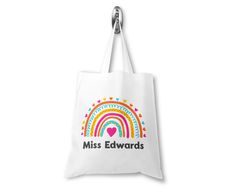 "Personalised Rainbow Teacher Bag Customisable Name, Custom Leaving End of Term Gift, Teacher Tote Bag Show the teacher in your child's life how much you appreciate what they do with the Personalised Teacher Tote Bag. With a super cute rainbow design on a simple white bag with customisable lettering of your choosing, these bags are designed, made, and lovingly wrapped in the UK. Your child's teacher is sure to love this eco-friendly, handy tote bag for storing shopping, carrying teaching supplie Leaving Gifts For Teachers, Blank Tote Bag, Teacher Tote Bag, Teacher Bag, Handbags For School, Rainbow Bag, Teachers Gifts, Teacher Bags, Teaching Supplies