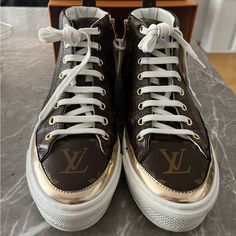 Size 35. Gold Accents. Canvas Lv Print. Rubber Soles. Side Zipper For Easy Pull On/Pull Off. Worn 10 Times (Max) Total. Comes With Original Box And 2 Dust Bags. Some Creasing And Minor Staining From Being Worn With Jeans. Luxury Patent Leather Custom Sneakers With Round Toe, Designer Patent Leather Sneakers With Round Toe, Luxury Patent Leather Lace-up Sneakers, Luxury Sneakers With Round Toe And Laces, Luxury High-top Patent Leather Sneakers, Luxury High-top Sneakers With Medium Fit, Luxury High-top Medium Fit Sneakers, Luxury High-top Sneakers Medium Fit, Luxury Sneakers With Laces