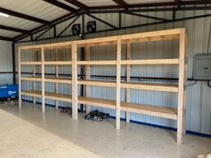 an empty storage room with shelves and tools