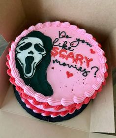 a birthday cake in a box with the words do you like scary things? on it