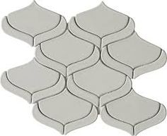 a white tile with wavy shapes