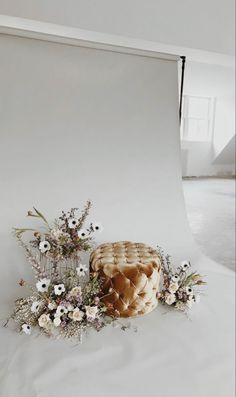 an empty photo studio with flowers on the floor