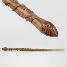 a wooden stick that has been carved to look like a leaf