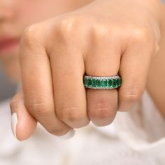 Real emerald octagon diamond eternity band ring gold | Natural emerald cut emerald diamond ring gold | Real emerald cut emerald ring gold GEMSTONE DETAILS : ✦ Gemstone : Emerald ✦ Gemstone Type : Natural ✦ Gemstone Size : 5x3 MM ✦ Gemstone Shape : Emerald cut / Octagon cut ✦ Number of Gemstones : 21 ✦ Gemstone Weight : 5-6 carats ✦ Gemstone Grade : AAA DIAMOND DETAILS : ✦ Diamond Type : Natural ✦ Diamond Size : 1.00 mm ✦ Diamond Color : F-G ✦ Diamond Clarity : Slightly included ✦ Diamond Cut : E Fine Jewelry Octagon Emerald Ring With Diamond Accents, Emerald Cut Emerald Ring With Baguette Diamonds, Emerald Octagon Ring With Diamond Cut, Emerald Cut Emerald Ring With Diamond Details, Green Emerald Cut Half Eternity Ring, Emerald Cut Emerald Ring, Emerald Eternity Ring, Emerald Band Ring, Diamond Ring Gold