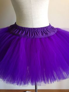 "This adult size tutu features your choice of tulle in colors of red, purple, blue, green, yellow,white black or orange sewn onto a fabric waistband. Tulle is aprox 11 inches in length. Waistband is 3 inches in length. Elastic fits waists size 27\" - 39\". Also available in plus sizes. Check out the TuTu section of my shop for my complete line of adult sized TuTus, headband tutus and pet tutus." Fitted Purple Tutu Dress For Spring, Spring Costume Tulle Tutu Dress, Spring Tulle Tutu Dress For Costume, Fitted Purple Petticoat For Party, Fitted Purple Tutu Dress For Costume, Purple Tulle Tutu Dress For Costume Party, Fitted Lavender Tulle Tutu Dress, Purple Tutu Dress For Costume Party In Summer, Purple Tutu Dress For Summer Costume Party