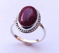 925 solid sterling silver fashionable handmade minimalist ring, with Natural Indian Ruby gemstone. Ring Weight - 4.40 Gram Stone Size - 10 X 14 MM (Indian Ruby) Ring Size - Choose From Variation Please, This ring is made from 925 sterling silver. This natural Indian Ruby Cabochon ring is finely polished to give a brilliant mirror finish. With rejuvenating design and sleek appearance, this ring looks stunning on fingers. If you have any additional questions about this Product, just hit the "Ask a Oval Sterling Silver Ruby Ring Stamped 925, Oval Ruby Ring In Sterling Silver Stamped 925, Classic Sterling Silver Cabochon Ruby Ring, Silver Ruby Ring With Oval Cabochon, Sterling Silver Ruby Ring Oval Cabochon For Formal Events, Classic Sterling Silver Ruby Ring With Cabochon, Sterling Silver Ruby Ring, Oval Cabochon For Formal Events, Formal Sterling Silver Ruby Ring With Oval Cabochon, Simple Oval Silver Jewelry