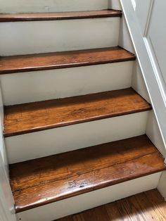 a set of wooden stairs leading up to the top floor in a house or home