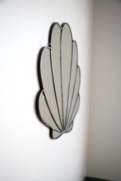 a mirror mounted to the side of a wall