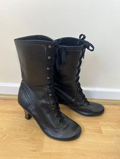 A pair of vintage Schuh black lace up Victorian style leather boots. The inside has some flaking and cracks to the lining. UK Size 5 EU Size 38 Heel height - 3 inches Vintage High Heel Lace-up Boots For Fall, Winter Vintage High Heel Lace-up Boots, Vintage Black Lace-up Heeled Boots, Vintage Fitted Boots With Laces, Vintage Black Heeled Boots For Winter, Vintage Leather Knee-high Lace-up Boots, Vintage Leather Sole Combat Boots For Fall, Vintage Combat Boots With Leather Sole, Vintage Combat Ankle Boots With Leather Sole