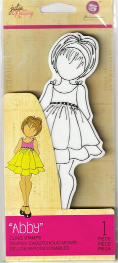 a paper cutout of a girl in a yellow dress