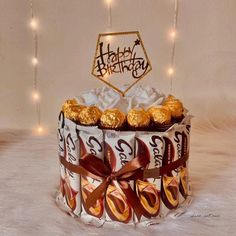 a birthday cake decorated with chocolates and candies