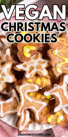 vegan christmas cookies on a plate with icing and candy in the background text reads vegan christmas cookies